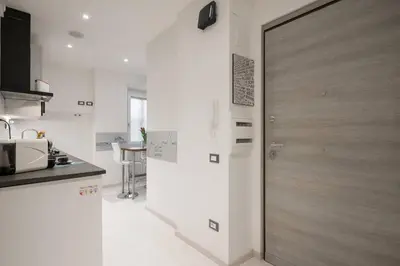 a kitchen with a sliding door in a kitchen at RomeEyes apartment in Rome