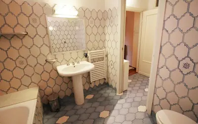 a bathroom with a sink and a mirror at Family 2BR Apartment in Via Giulia in Rome