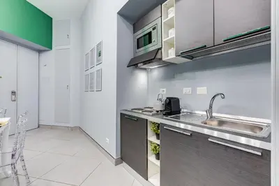 a kitchen with a sink and a counter at Luxury Trevi Fountain - Your Italian Holidays in Rome