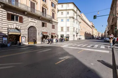 an empty city street with people walking on the street at Luxury Trevi Fountain - Your Italian Holidays in Rome