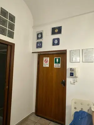 a room with a door and signs on the wall at Marcelina in Rome