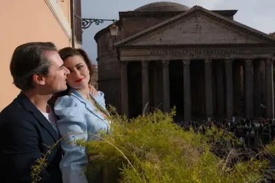 a man and a woman standing in front of a building at Casa Morgana - The Pantheon Balcony Suite in Rome