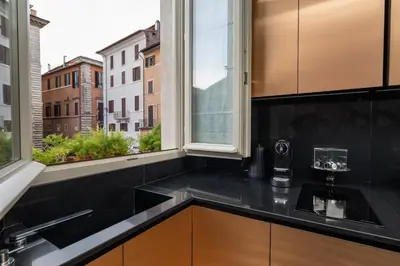 a kitchen with a sink and a window at Casa Morgana - The Pantheon Balcony Suite in Rome