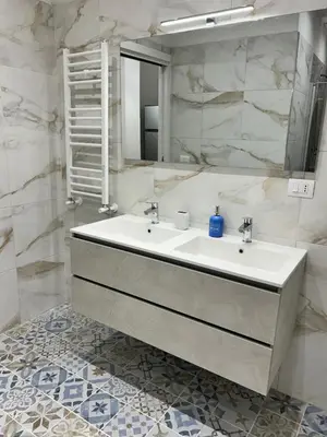 a bathroom with a sink and a mirror at San Peter Vale House in Rome