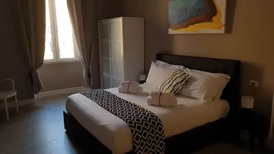 a bedroom with a bed with two boxes on it at San Peter Vale House in Rome