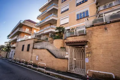 a small bedroom with a bed and a bathroom at Apartment Bentivoglio in Rome