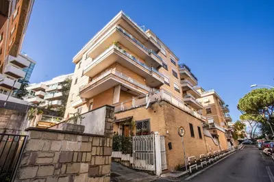 a brick building with stairs on the side of it at Apartment Bentivoglio in Rome