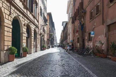 a cobblestone street in a city with buildings at Three bedrooms in world-famous Via Giulia - FromHometoRome in Rome