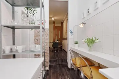 a bathroom with white counters and a sink at Urbana Delicious Flat in Rome