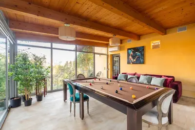 a living room with a pool table in it at Relais Clivo Vaticano in Rome