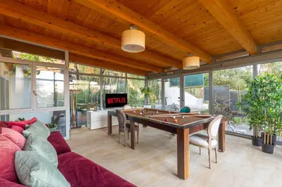 a living room with a pool table and a couch at Relais Clivo Vaticano in Rome