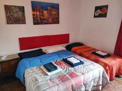 two beds sitting next to each other in a room at Napoleone's House in Rome