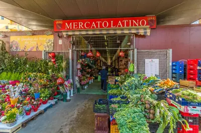 a market with vegetables and flowers in a store at Casa Epiro in Rome