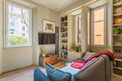 a living room with a couch and a tv at Casa Epiro in Rome