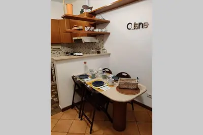 a small kitchen with a table in a room at Lanza Tomasi Apartment - centre in Rome