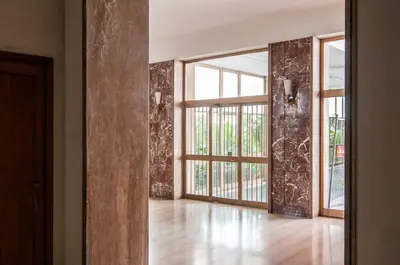 an empty room with a sliding glass door at Wood Easy Flat in Rome