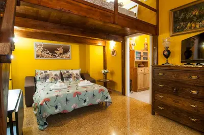 a bedroom with a large bed and a dresser at Wood Easy Flat in Rome