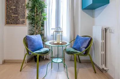 a bedroom with a large bed with towels on it at Trevi Fountain Stylish Penthouse IREX Apartment in Rome