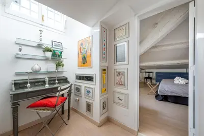 a room with a desk and a red chair at Trevi Fountain Stylish Penthouse IREX Apartment in Rome