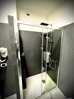 a shower with a glass door in a bathroom at Prati Comfort in Rome