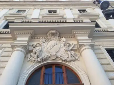 a building with a clock on the side of it at Biancorè in Rome
