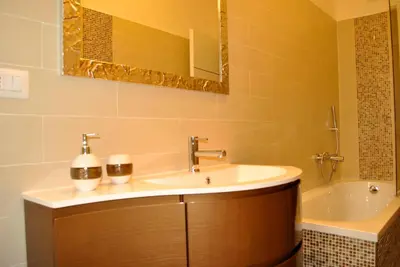 a bathroom with a sink and a tub at Demi's home in Rome