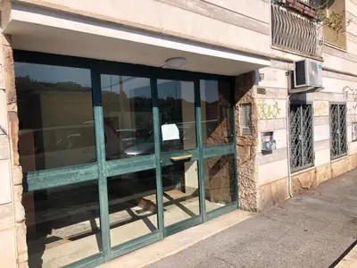 a window on a building with green trim at Questa casa non è un albergo CIU-ATR 9390-9 in Rome