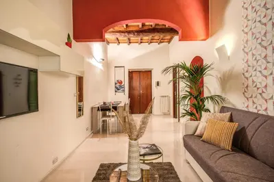 a living room with a couch and a table at FRESH HOUSE CAVOUR in Rome