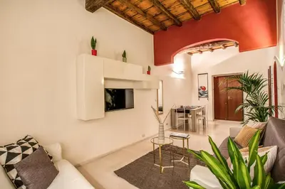 a living room with a couch and a table at FRESH HOUSE CAVOUR in Rome