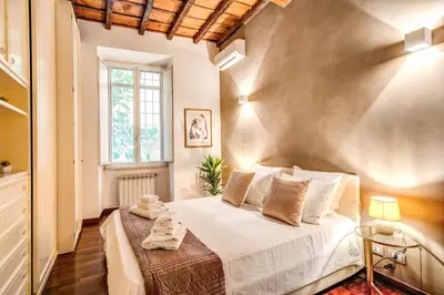 a bedroom with a large white bed in a room at FRESH HOUSE CAVOUR in Rome