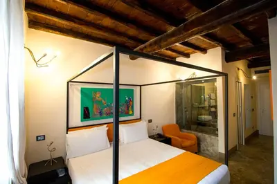 a bedroom with a canopy bed in a room at Residenze Argileto in Rome