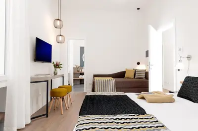 a living room with two beds and a couch at Charme 308 in Rome
