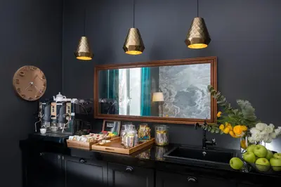 a counter with a large mirror on top of it at Charme 308 in Rome