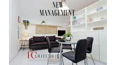 a living room with a couch and a table and chairs at Relax Chiavari House in Rome