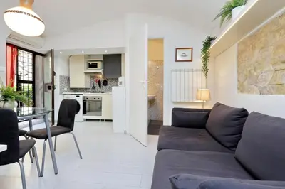 a living room with a couch and a table at Relax Chiavari House in Rome