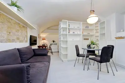 a living room with a couch and a table at Relax Chiavari House in Rome