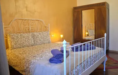 a bedroom with a white bed with a mirror at Sophie's Choice 2 a San Pietro in Rome