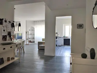 a living room with a kitchen and a dining room at Casa Giustiniano - Metro San Paolo in Rome