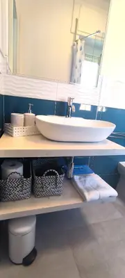 a bathroom with a sink and a mirror at Casa Giustiniano - Metro San Paolo in Rome