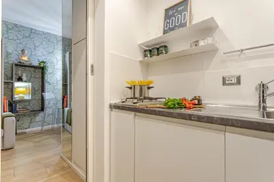 a kitchen with a sink and a counter top at Green Terrace Loft Colosseum in Rome