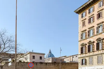 a building with a dome in the background at My Home in San Pietro in Rome