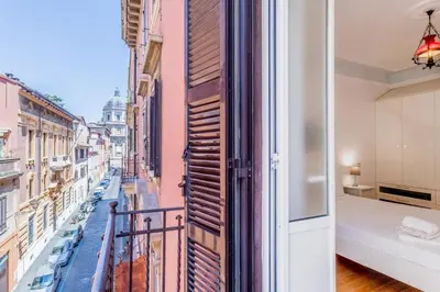 a balcony with a view of a city at BBHOME Comfort apartment near Colosseum in Rome