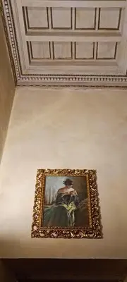 a framed painting of a man on a wall at Residenza al Pantheon - RH Collection in Rome