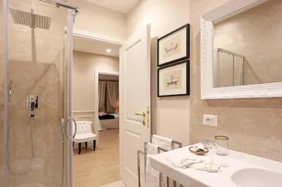 a bathroom with a sink and a shower at Daplace - Lucrezia Apartment in Rome