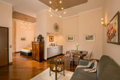 a living room with a couch and a table at Flaminia Charme in Rome