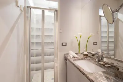 a bathroom with a sink and a shower at Flaminia Charme in Rome