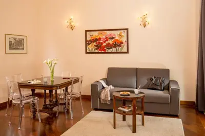 a living room with a couch and a table at Flaminia Charme in Rome