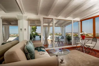 a living room with a couch and a table at Daplace - Terenzia Apartment in Rome
