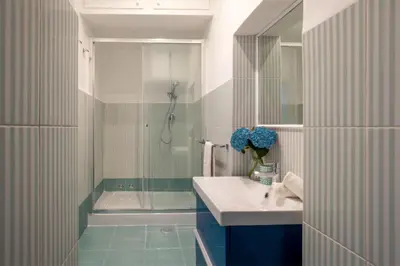 a bathroom with a sink and a shower at Daplace - Flaminia Apartment in Rome