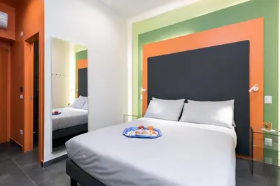 a bedroom with a bed with a plate of fruit on it at Circle in the Square in Rome